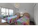Twin bedroom with two beds, featuring matching bedding and window treatments at 1201 Winding Willow Ct, Kissimmee, FL 34746