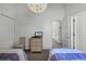 Spacious bedroom with two twin beds and access to hallway at 1201 Winding Willow Ct, Kissimmee, FL 34746