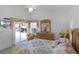 Primary bedroom with sliding doors to patio and pool access at 1201 Winding Willow Ct, Kissimmee, FL 34746
