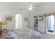Primary bedroom with access to living room and bathroom at 1201 Winding Willow Ct, Kissimmee, FL 34746