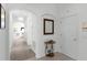 Entryway with mirror and view down the hall at 1201 Winding Willow Ct, Kissimmee, FL 34746