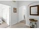 View of the entryway with an arched hallway and a mirror at 1201 Winding Willow Ct, Kissimmee, FL 34746