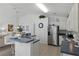 Bright kitchen features stainless steel appliances and an island with seating at 1201 Winding Willow Ct, Kissimmee, FL 34746