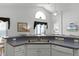 Kitchen with double sink and a view of the living area at 1201 Winding Willow Ct, Kissimmee, FL 34746