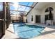 Screened pool and patio furniture at 1201 Winding Willow Ct, Kissimmee, FL 34746
