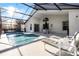 Screened pool and patio furniture at 1201 Winding Willow Ct, Kissimmee, FL 34746