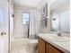 Clean bathroom featuring a tub, shower, and vanity at 124 Cassia Dr, Davenport, FL 33897