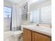 Clean bathroom featuring a tub, shower, and vanity at 124 Cassia Dr, Davenport, FL 33897