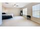 Spacious Primary bedroom with ample natural light and ceiling fan at 124 Cassia Dr, Davenport, FL 33897