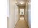 Long hallway with two closets leading to bathroom at 124 Cassia Dr, Davenport, FL 33897
