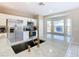 Modern kitchen with a large island, stainless steel appliances, and a gold faucet at 124 Cassia Dr, Davenport, FL 33897