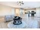 Open concept living room and kitchen with tiled floors at 124 Cassia Dr, Davenport, FL 33897