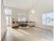 Bright living room with a large sectional sofa and high ceilings at 124 Cassia Dr, Davenport, FL 33897
