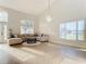 Bright living room with a large sectional sofa and high ceilings at 124 Cassia Dr, Davenport, FL 33897
