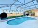 Inviting kidney-shaped pool with screened patio at 124 Cassia Dr, Davenport, FL 33897