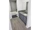 Bathroom with gray vanity, dark-gray floor tile, and a white sink at 13803 Fairway Island Dr # S, Orlando, FL 32837