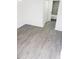 Spacious bedroom with gray vinyl flooring at 13803 Fairway Island Dr # S, Orlando, FL 32837