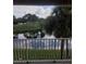 Relaxing view of a pond and lush landscaping from private balcony at 13803 Fairway Island Dr # S, Orlando, FL 32837