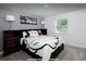 Comfortable bedroom with a queen-size bed and Mickey Mouse bedding at 152 Pinewood Dr, Davenport, FL 33896