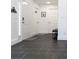 Bright entryway with dark tile floors and white doors at 152 Pinewood Dr, Davenport, FL 33896