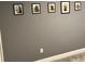 Gray accent wall with framed artwork at 152 Pinewood Dr, Davenport, FL 33896