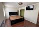Main bedroom with a large bed, built-in shelving, and a walk-in closet at 1592 Martin Luther King Ne Blvd, Winter Haven, FL 33881