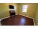 Bright bedroom with laminate flooring, a window, a ceiling fan, and room for personalization at 1592 Martin Luther King Ne Blvd, Winter Haven, FL 33881