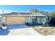 Light green single story house with attached garage and small front yard at 1592 Martin Luther King Ne Blvd, Winter Haven, FL 33881