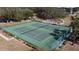 An aerial shot displaying the community tennis courts and playground at 1717 Clubhouse Cv, Haines City, FL 33844