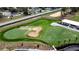 Aerial view of putting green and clubhouse at 1717 Clubhouse Cv, Haines City, FL 33844