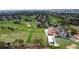 Aerial view of golf course, clubhouse, and parking lot at 1717 Clubhouse Cv, Haines City, FL 33844