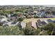 Aerial view of neighborhood with houses and a green space at 1717 Clubhouse Cv, Haines City, FL 33844