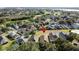 Aerial view highlighting a home's location near a golf course at 1717 Clubhouse Cv, Haines City, FL 33844