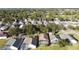 An aerial view of a beautiful neighborhood with mature trees and well-maintained homes at 1717 Clubhouse Cv, Haines City, FL 33844