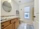 Bathroom featuring a sink, mirror, toilet, and bath tub at 1717 Clubhouse Cv, Haines City, FL 33844
