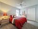 Cozy bedroom featuring a plush bed, closet, and side table at 1717 Clubhouse Cv, Haines City, FL 33844