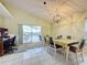 Bright dining room with tiled floors and sliding doors to outdoor living space at 1717 Clubhouse Cv, Haines City, FL 33844