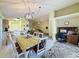 Open floorplan connects dining area to living spaces, perfect for entertaining at 1717 Clubhouse Cv, Haines City, FL 33844