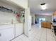 Bright eat-in kitchen with access to laundry room and back patio at 1717 Clubhouse Cv, Haines City, FL 33844