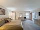 Bright main bedroom with neutral walls, carpeted flooring, and sliding door access to the patio at 1717 Clubhouse Cv, Haines City, FL 33844