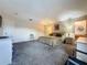 Spacious carpeted main bedroom featuring an ensuite bathroom and neutral walls at 1717 Clubhouse Cv, Haines City, FL 33844