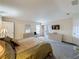 Open main bedroom with neutral walls, carpeted flooring, and sliding door access to the patio at 1717 Clubhouse Cv, Haines City, FL 33844