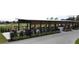 Covered patio with tables, chairs, and grilling area at 1717 Clubhouse Cv, Haines City, FL 33844
