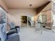 An outdoor seating area with direct access into the home through a sliding glass door at 1717 Clubhouse Cv, Haines City, FL 33844