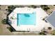 Overhead view of refreshing community pool with patio at 1717 Clubhouse Cv, Haines City, FL 33844