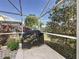View of the screened-in patio featuring a grill and beautiful backyard landscape at 1717 Clubhouse Cv, Haines City, FL 33844