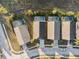 Aerial view of three houses with pools in a residential area at 1739 Morning Star Dr, Clermont, FL 34714