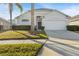 One-story house with a two-car garage and well-manicured lawn at 1739 Morning Star Dr, Clermont, FL 34714
