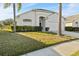 One-story house with a two-car garage and palm trees at 1739 Morning Star Dr, Clermont, FL 34714