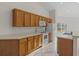 Kitchen features wood cabinets and modern appliances at 1739 Morning Star Dr, Clermont, FL 34714